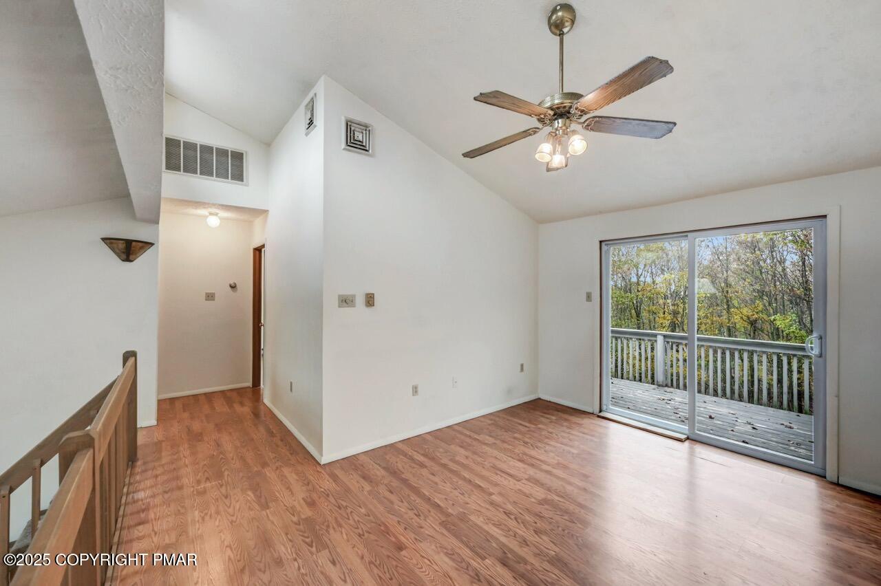 38 Spokane Road Albrightsville, PA 18210 - Photo 48 of 69 a view of a hallway with wooden floor and a ceiling fan