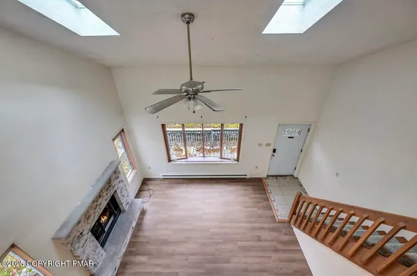 a view of balcony with wooden floor and fence