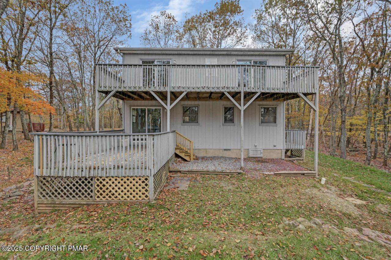 38 Spokane Road Albrightsville, PA 18210 - Photo 67 of 69 a view of a wooden house with a yard and fence
