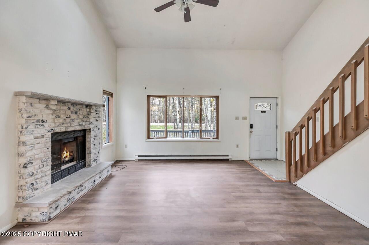 38 Spokane Road Albrightsville, PA 18210 - Photo 8 of 69 a view of an empty room with exposed radiator and fireplace