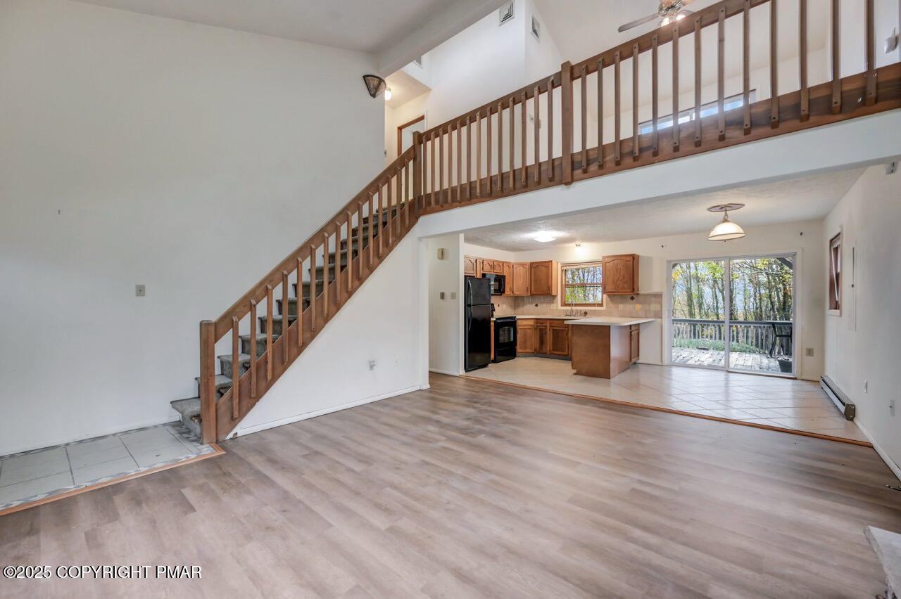 38 Spokane Road Albrightsville, PA 18210 - Photo 10 of 69 a view of staircase with white walls and wooden floor