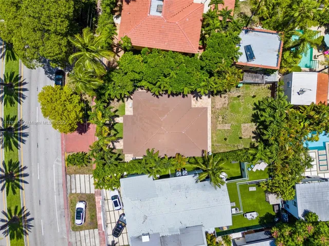 an aerial view of a house with a yard and a garden
