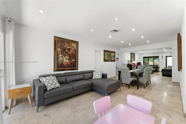 a living room with furniture and a rug