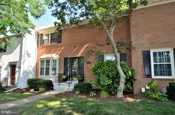 8521 Forrester Boulevard Springfield, VA 22152 - Photo 1 of 28 front view of a house with a yard