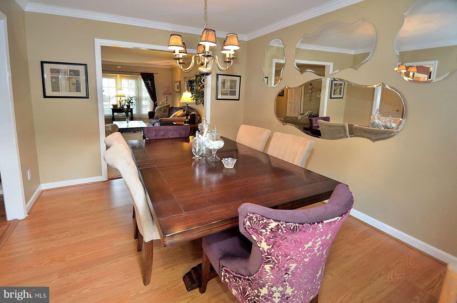 8521 Forrester Boulevard Springfield, VA 22152 - Photo 12 of 28 a view of a dining room with furniture