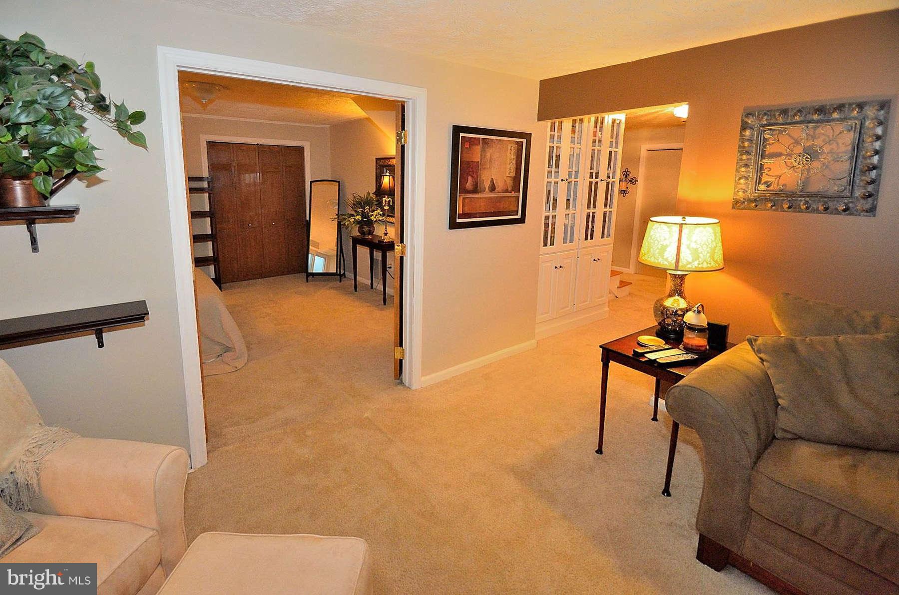 8521 Forrester Boulevard Springfield, VA 22152 - Photo 9 of 28 a view of a livingroom with furniture and windows
