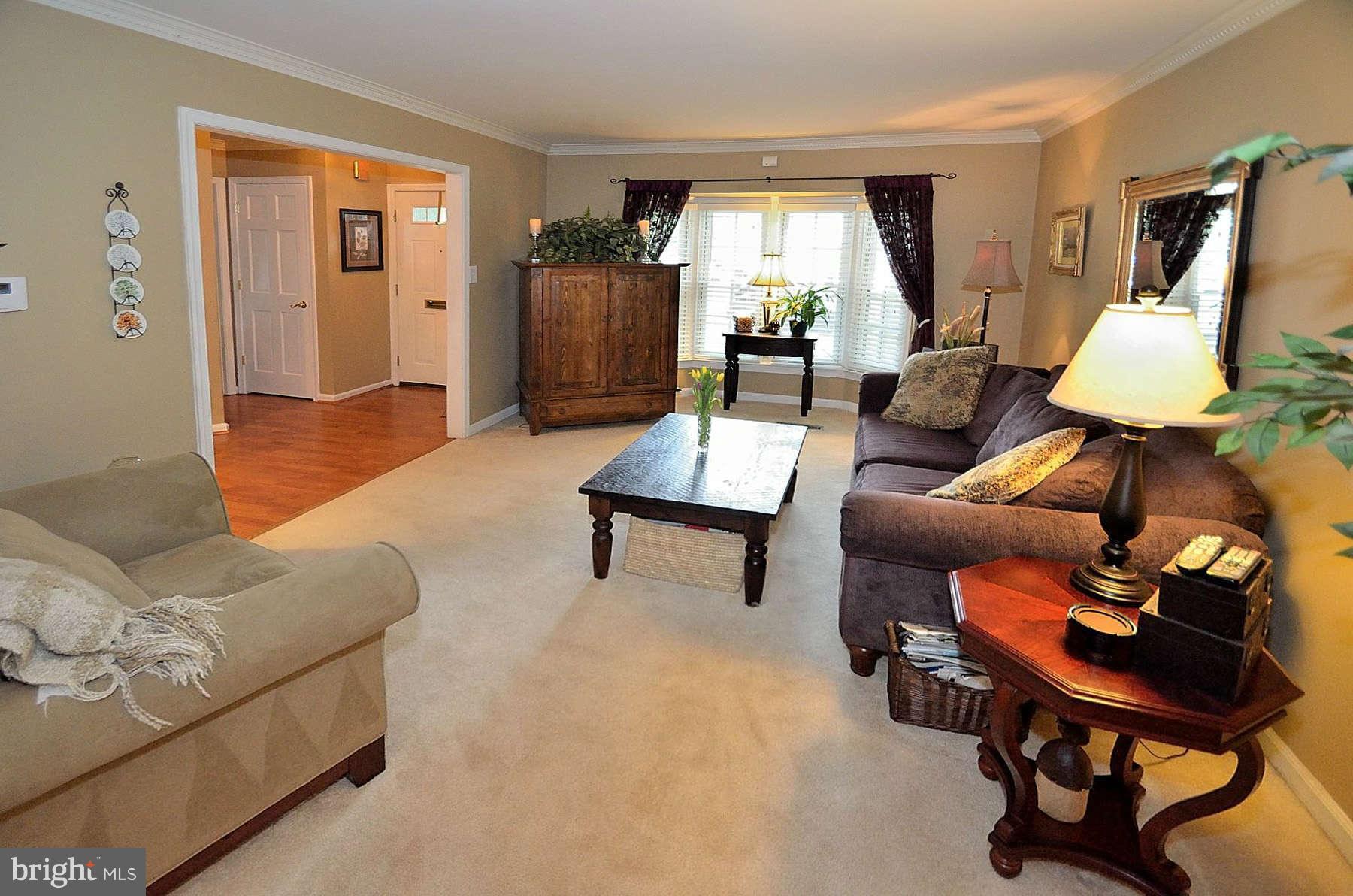 8521 Forrester Boulevard Springfield, VA 22152 - Photo 10 of 28 a living room with furniture and a window