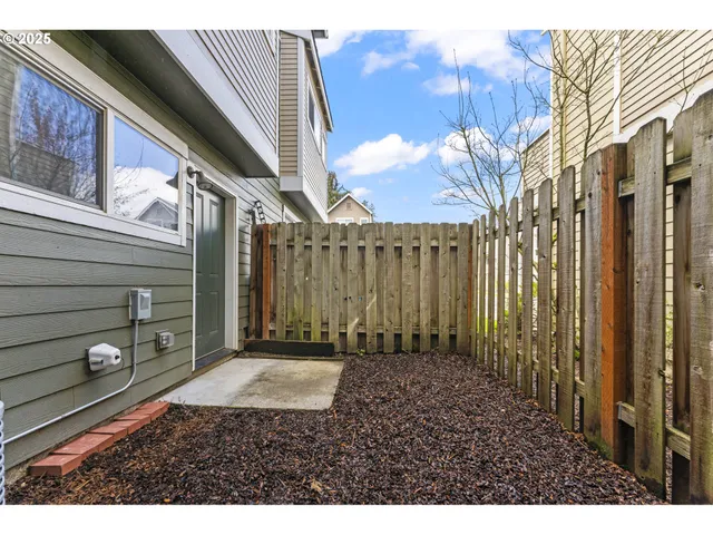 a view of a backyard with pathway