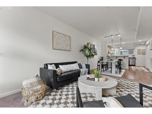 a living room with furniture and a table
