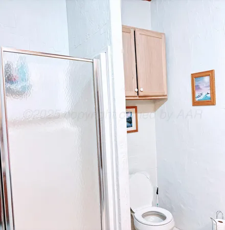 a bathroom with a shower and a tub
