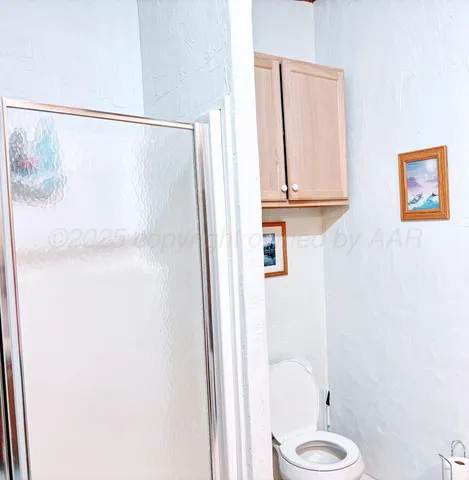 a bathroom with a shower and a tub