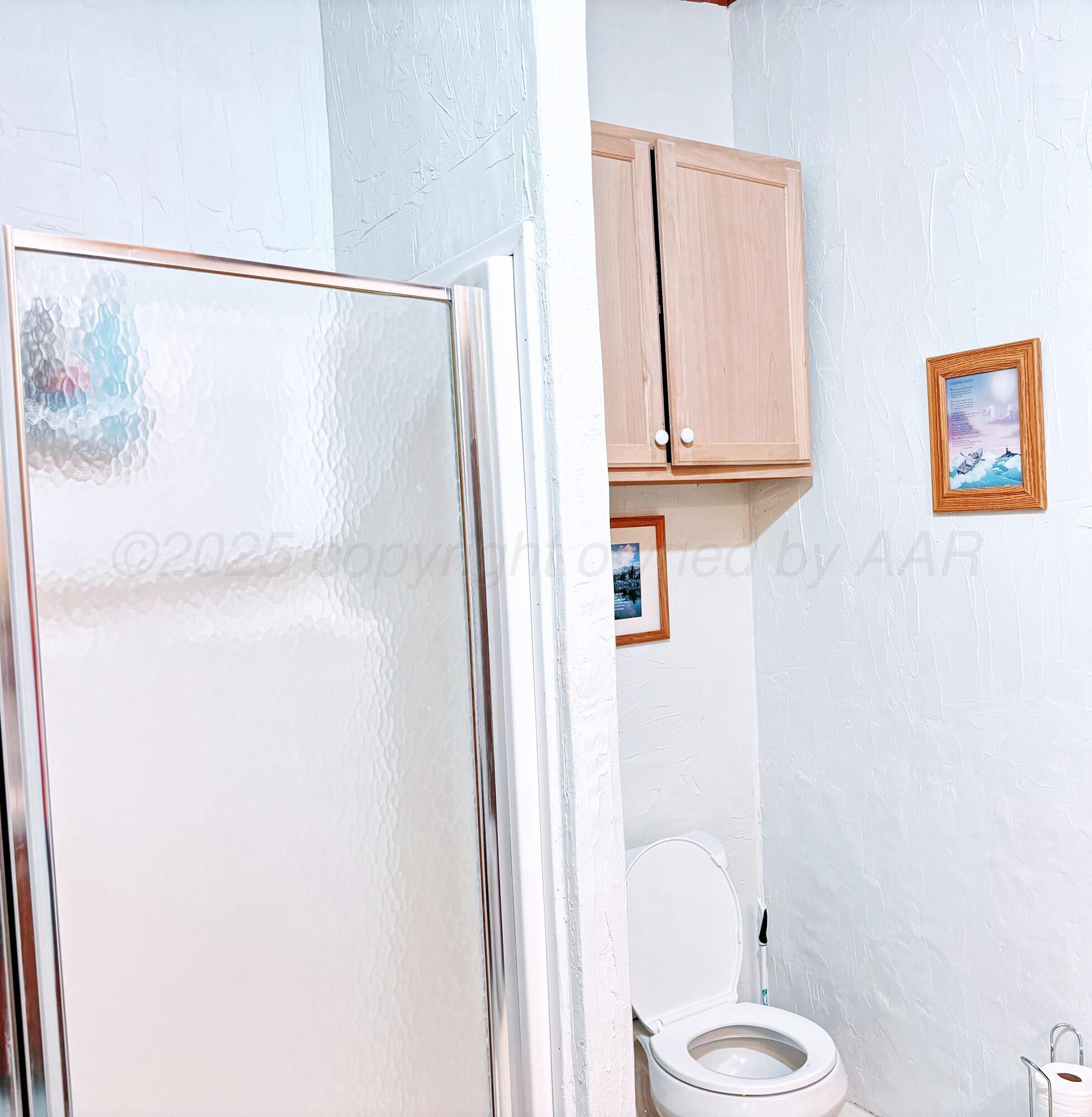 1010 South Baylor Street Perryton, TX 79070 - Photo 16 of 35 a bathroom with a shower and a sink