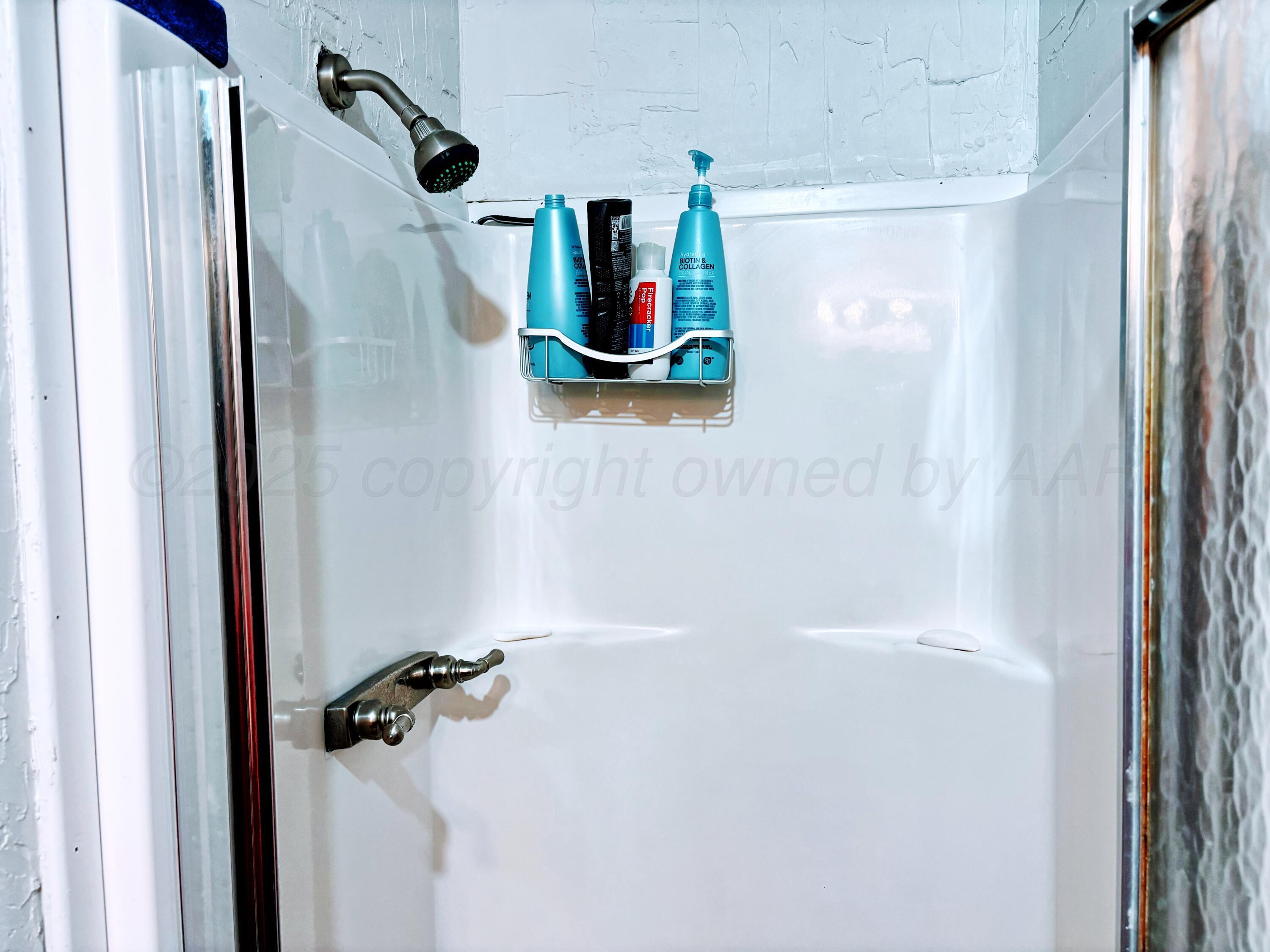 1010 South Baylor Street Perryton, TX 79070 - Photo 17 of 35 a bathroom with a shower and a tub