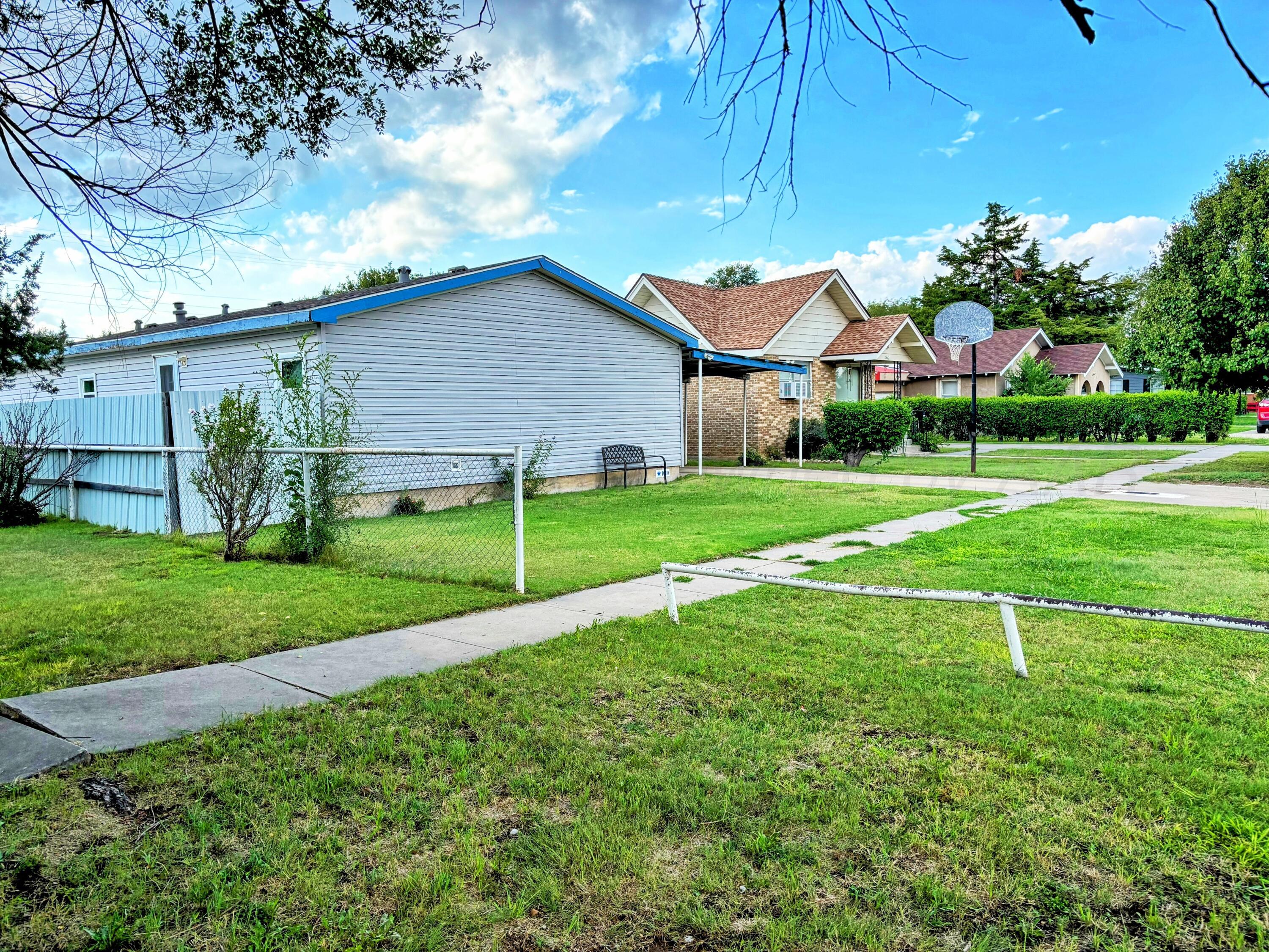 1010 South Baylor Street Perryton, TX 79070 - Photo 2 of 35 a view of a house with a yard