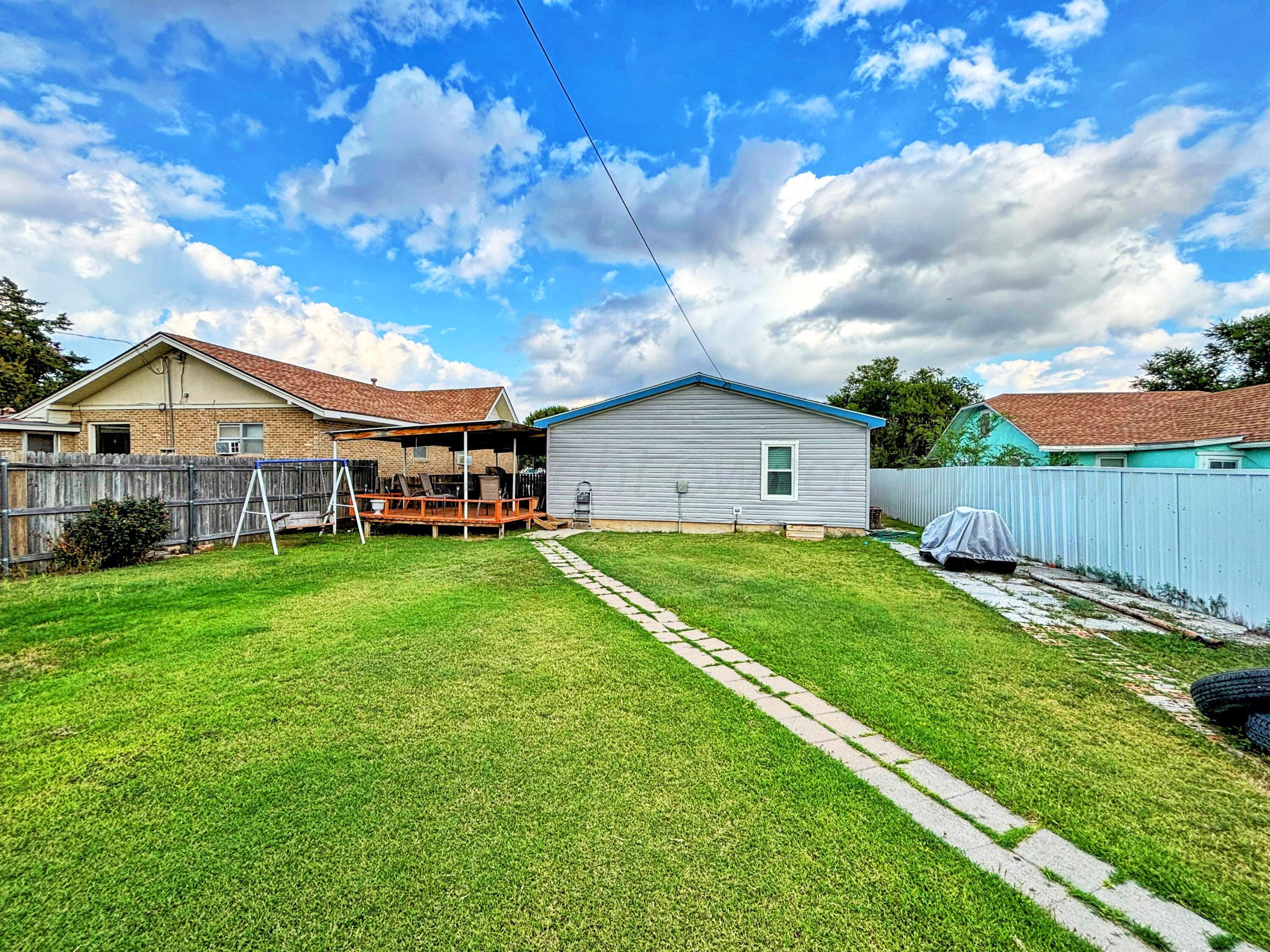 1010 South Baylor Street Perryton, TX 79070 - Photo 34 of 35 a view of house with backyard and entertaining space