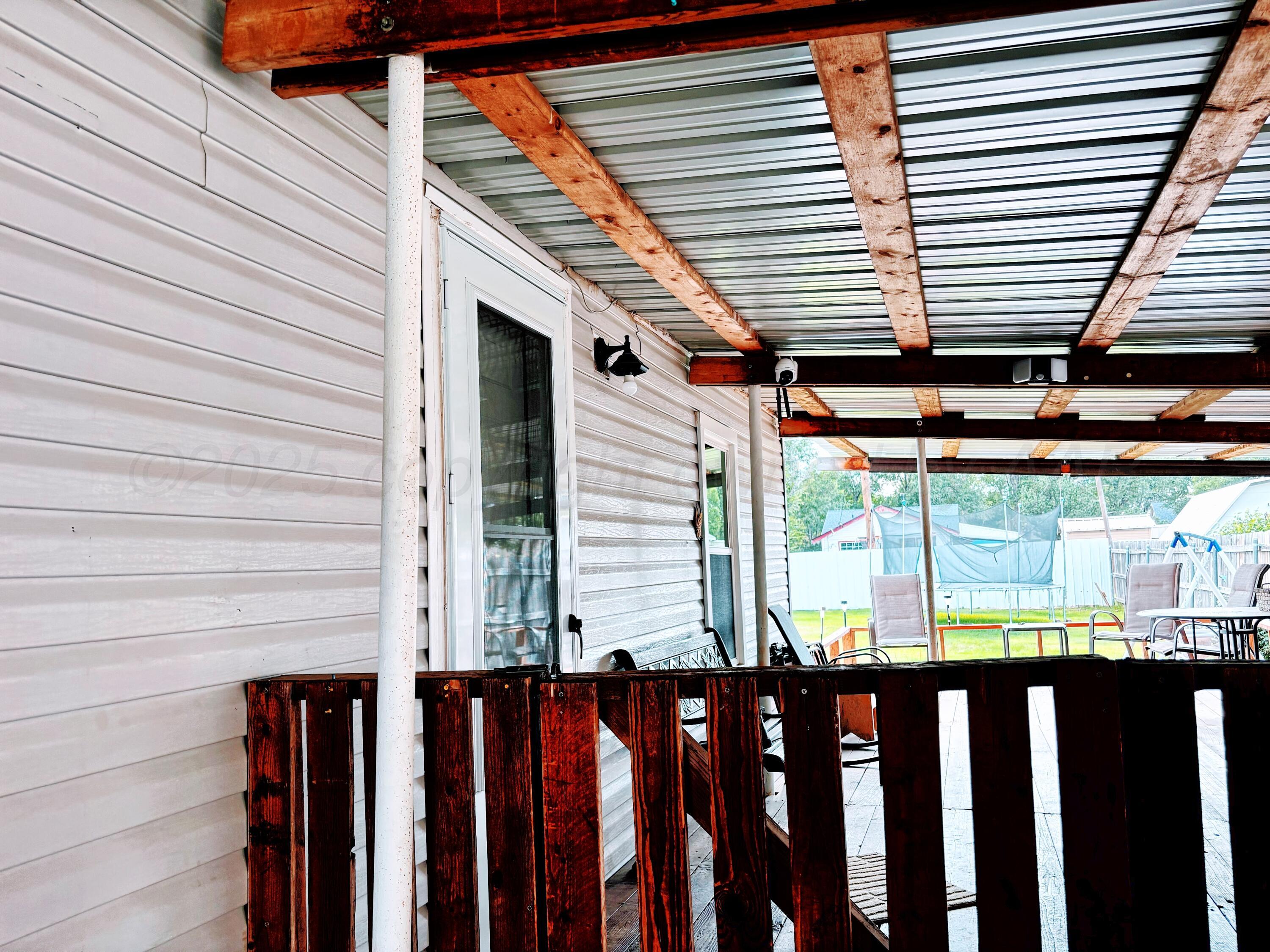 1010 South Baylor Street Perryton, TX 79070 - Photo 4 of 35 a front view of a house with wooden stairs