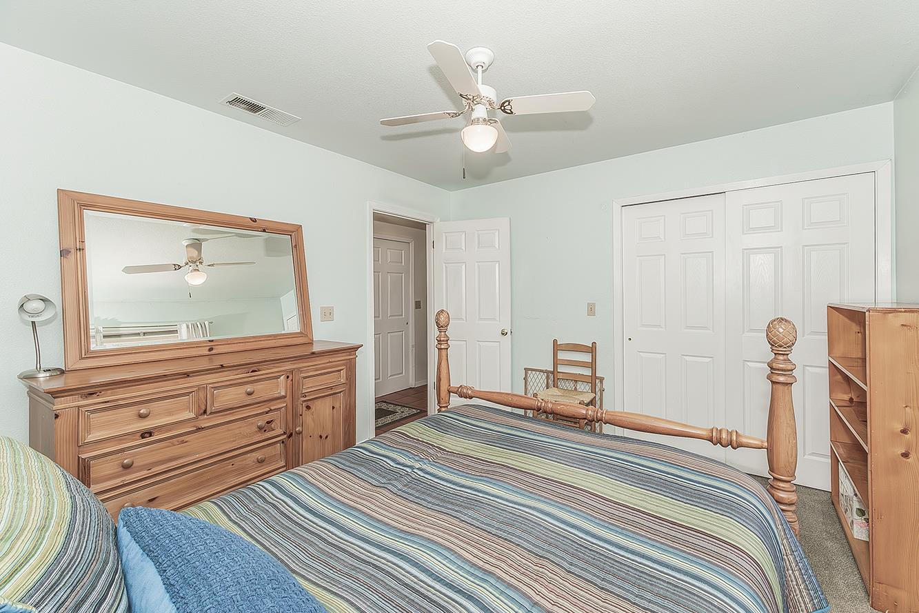 14815 Garlock Lane Prather, CA 93651 - Photo 29 of 80 a bedroom with a bed and a chandelier