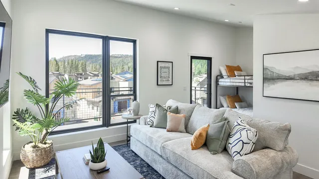 a living room with furniture and a large window