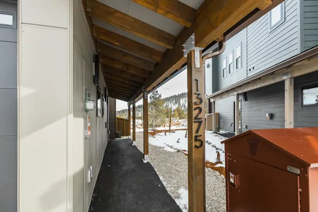 a view of a porch with wooden floor and stairs