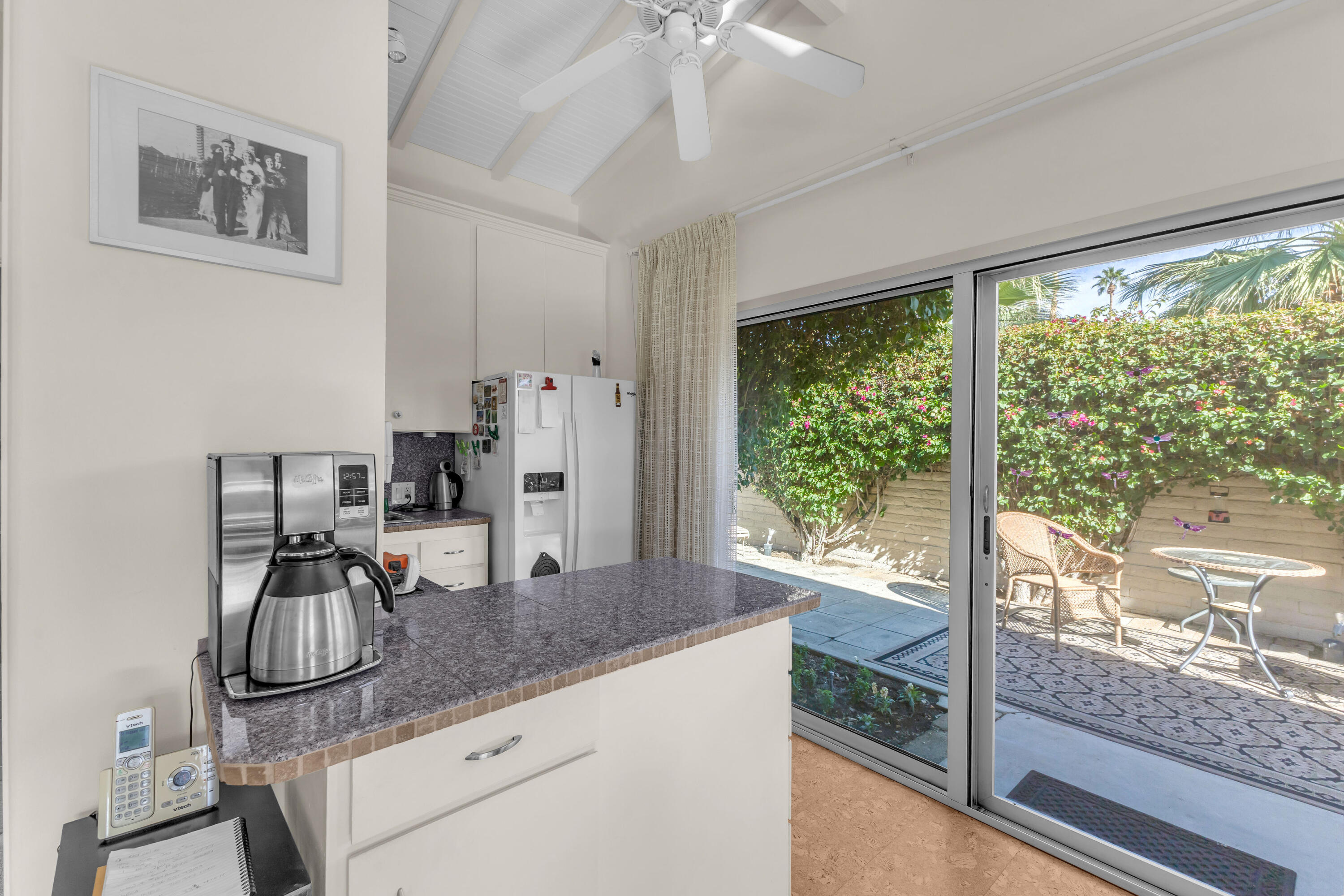 69850 Hwy 111 Rancho Mirage Ca, Unit 11 Rancho Mirage, CA 92270 - Photo 11 of 48 a view of a room with kitchen glass windows sink and furniture