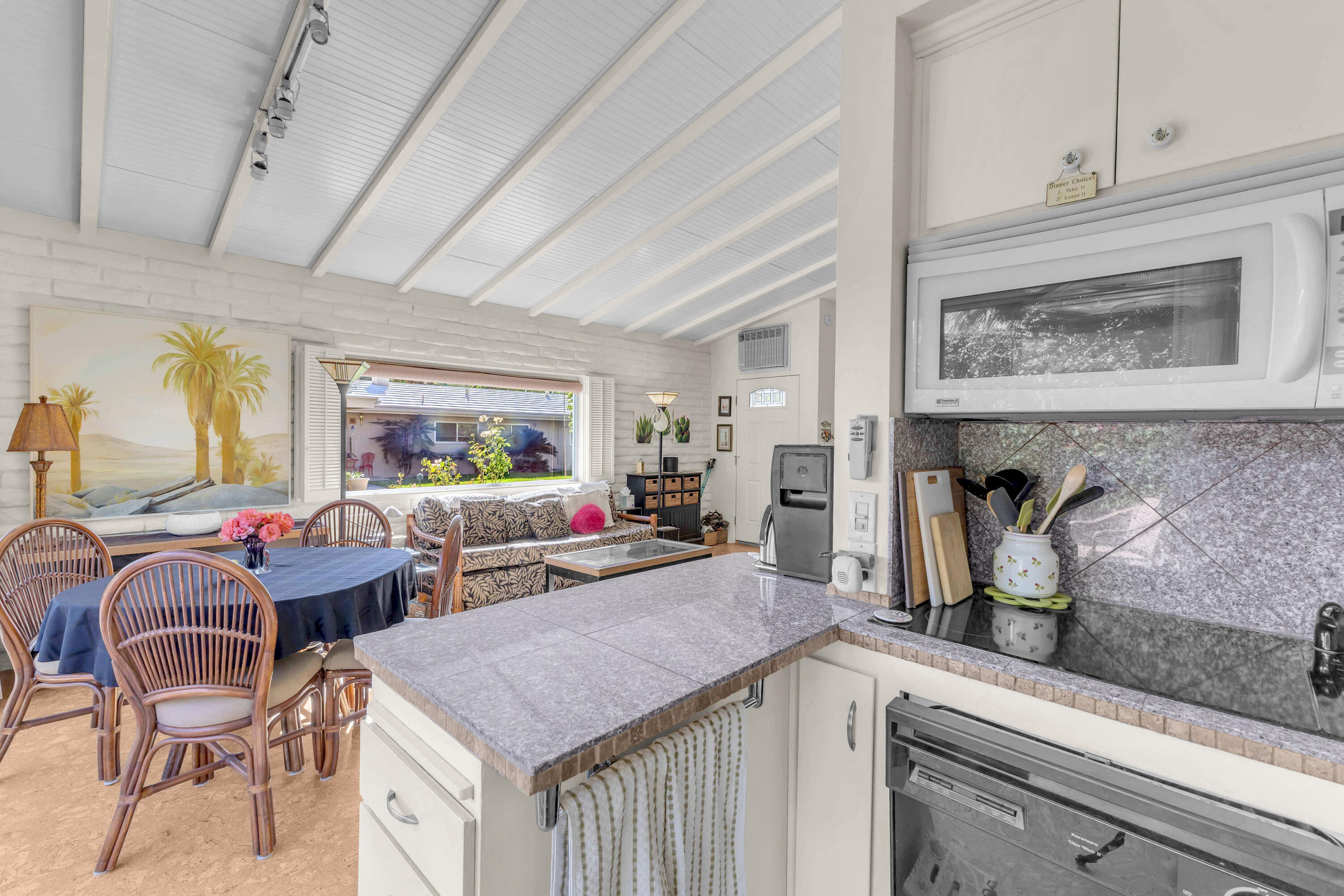 69850 Hwy 111 Rancho Mirage Ca, Unit 11 Rancho Mirage, CA 92270 - Photo 12 of 48 a living room with fireplace furniture and a potted plant