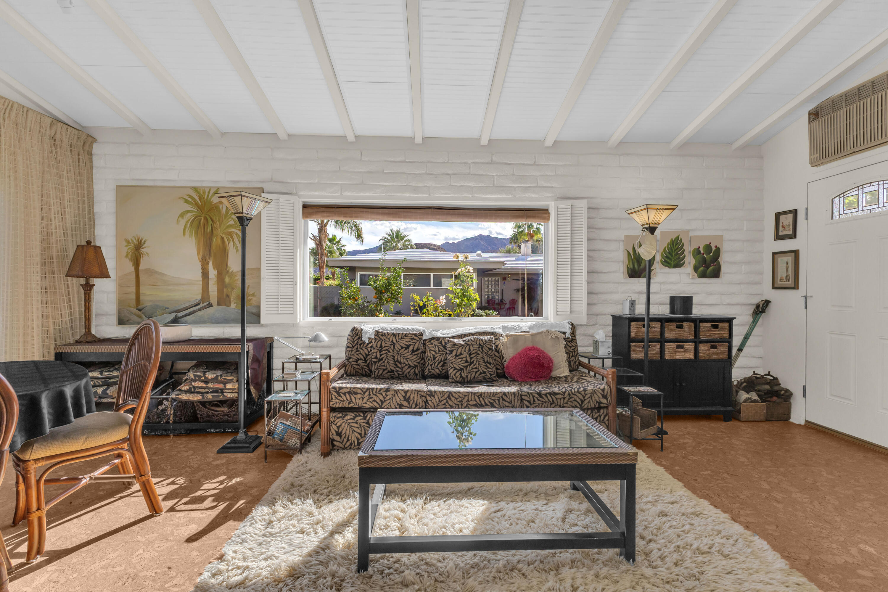 69850 Hwy 111 Rancho Mirage Ca, Unit 11 Rancho Mirage, CA 92270 - Photo 15 of 48 a living room with furniture and a fireplace