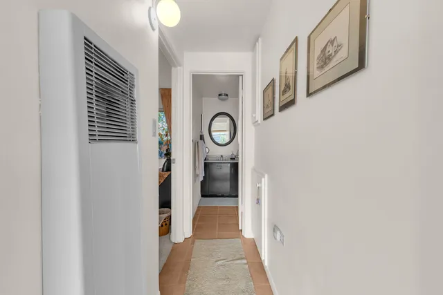 a view of an entryway with wooden floor
