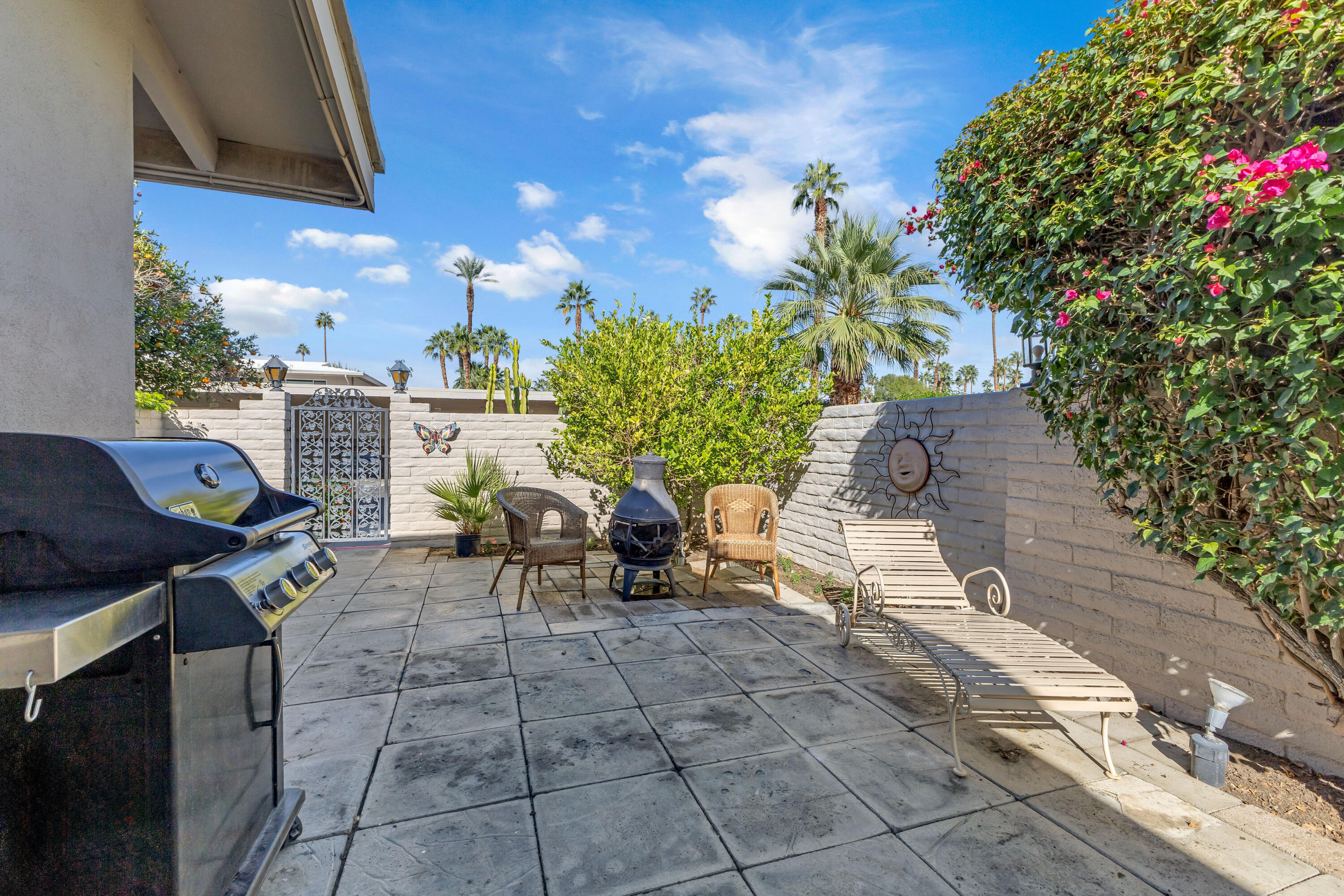 69850 Hwy 111 Rancho Mirage Ca, Unit 11 Rancho Mirage, CA 92270 - Photo 24 of 48 a view of a chairs and tables in the patio