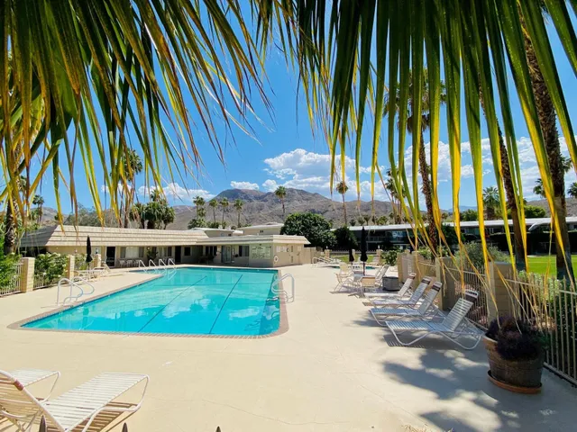 a view of a swimming pool with chairs