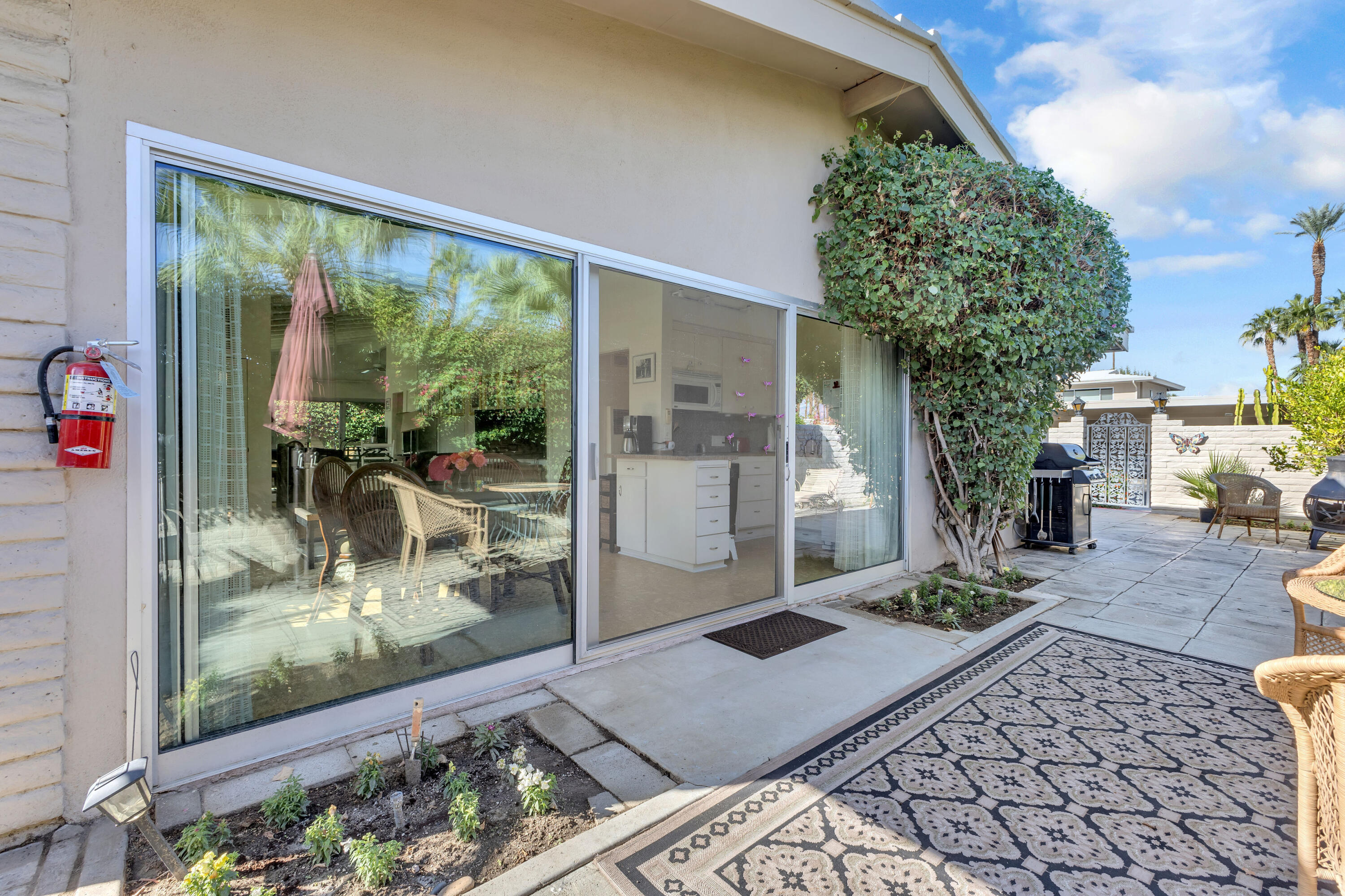 69850 Hwy 111 Rancho Mirage Ca, Unit 11 Rancho Mirage, CA 92270 - Photo 4 of 48 a room with lots of trees and furniture