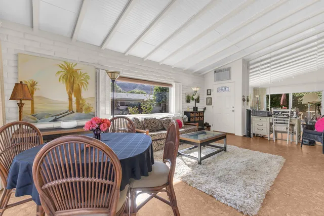 a living room with furniture and a table