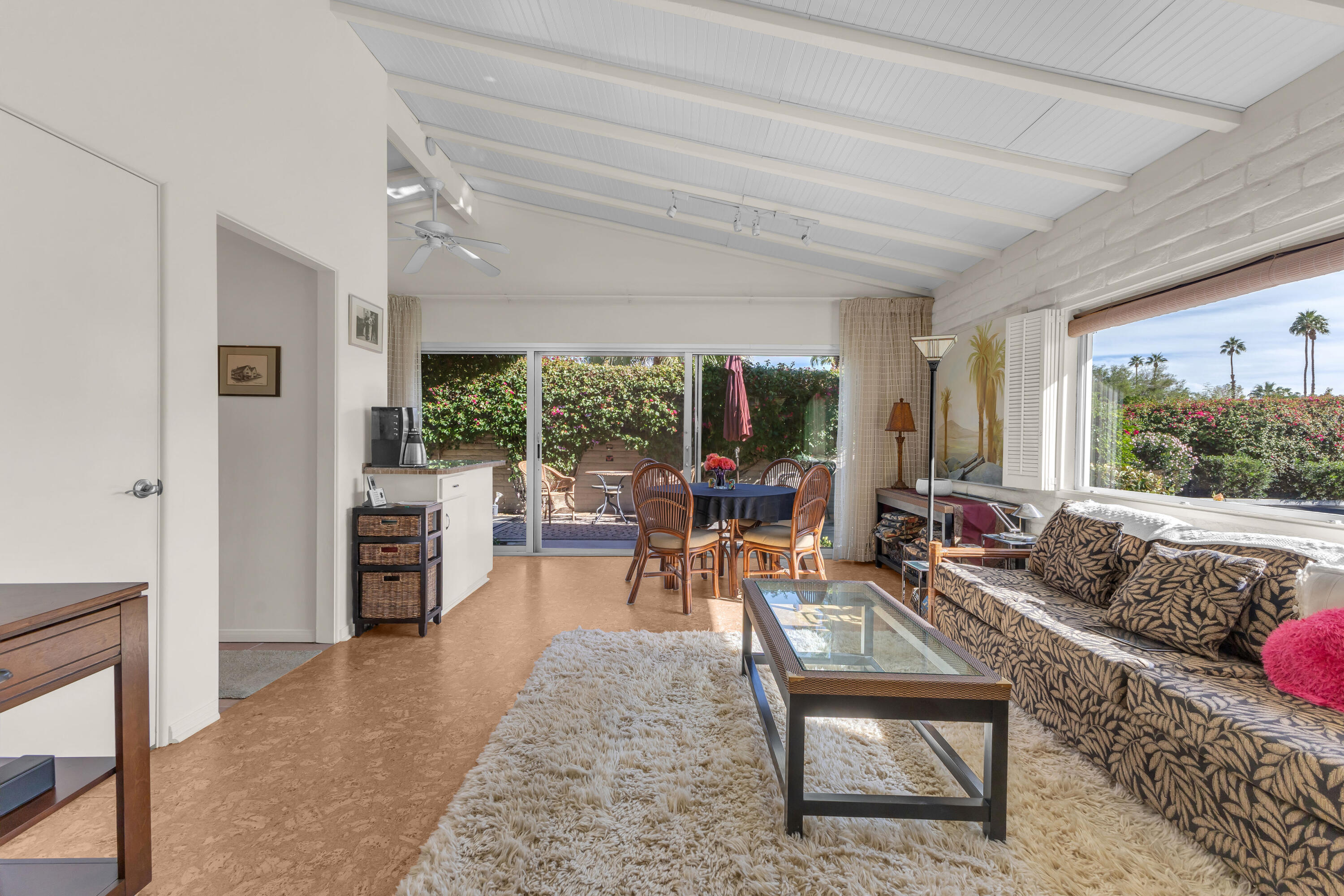 69850 Hwy 111 Rancho Mirage Ca, Unit 11 Rancho Mirage, CA 92270 - Photo 8 of 48 a living room with furniture and a large window