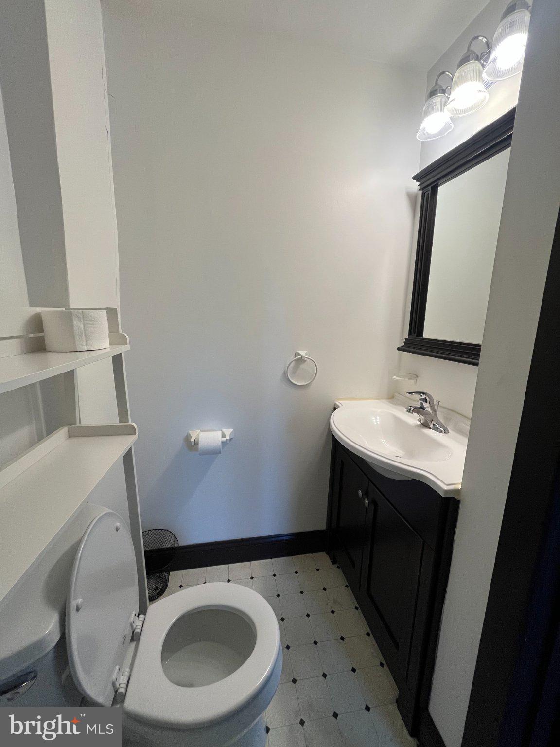 1660 Shimerville Road Emmaus, PA 18049 - Photo 17 of 26 a bathroom with a sink a toilet and mirror