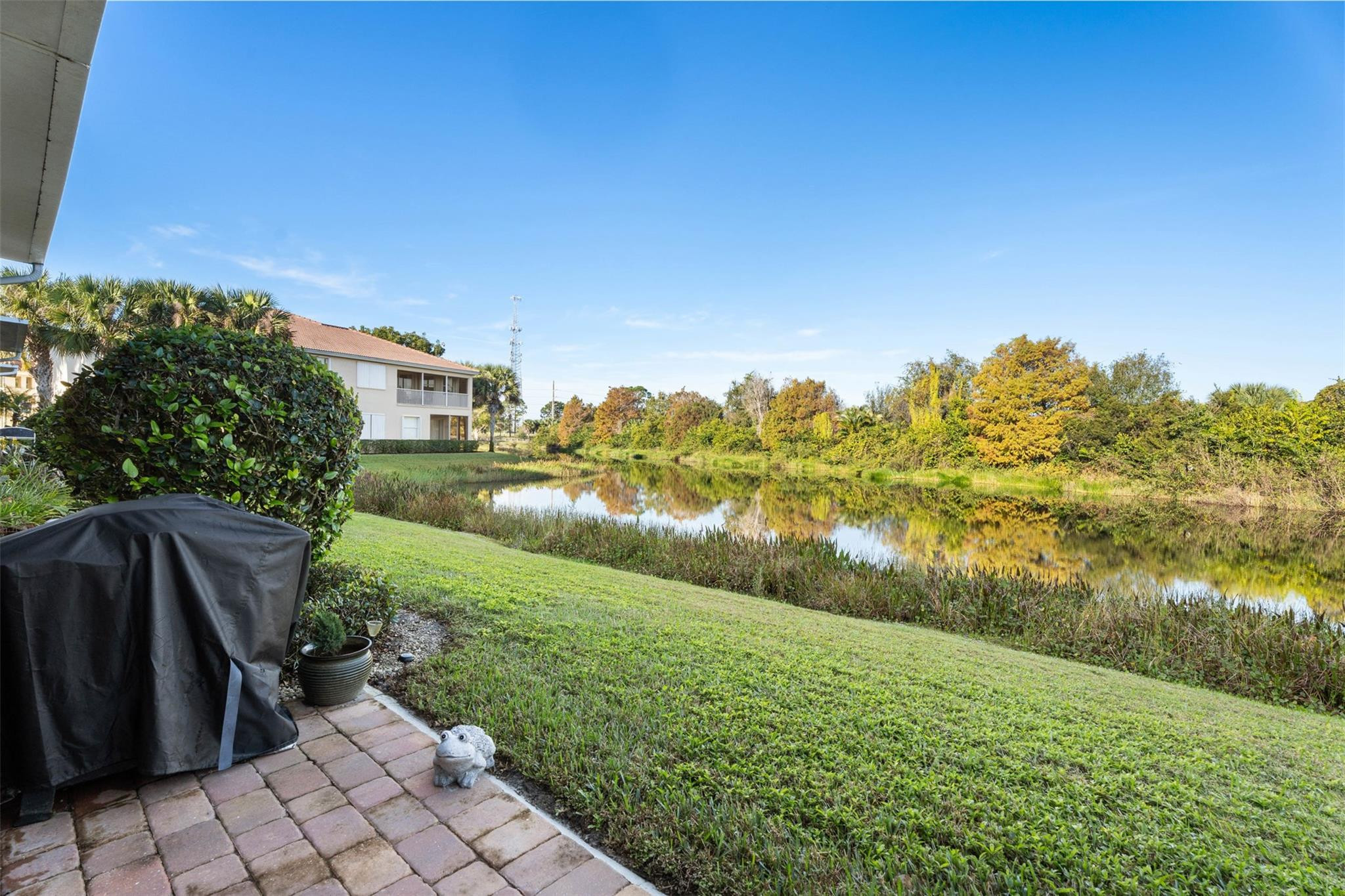 651 Southwest Glen Crest Way, Unit 2 Stuart, FL 34997 - Photo 16 of 41 a view of a lake with a yard