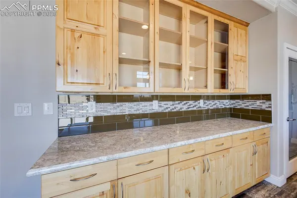 a kitchen with granite countertop white cabinets and a granite counter tops