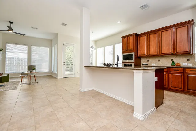 a kitchen with a stove and cabinets