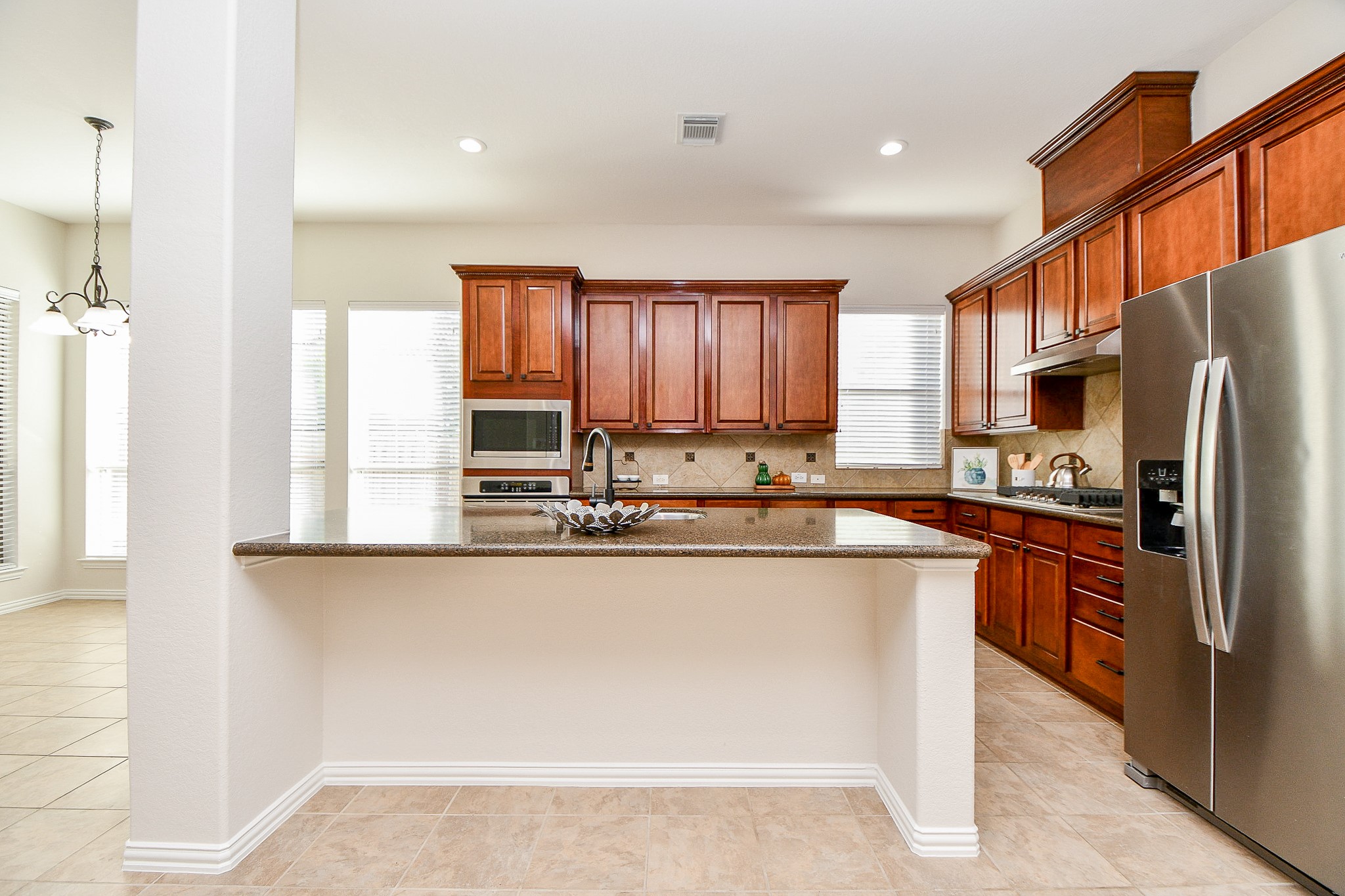 45 Cherry Hills Houston, TX 77064 - Photo 16 of 49 a kitchen with stainless steel appliances granite countertop a refrigerator sink and cabinets