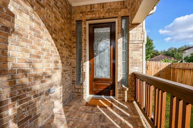 a view of a hallway view with living room and dining room view