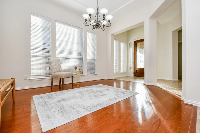 an empty room with furniture and a window