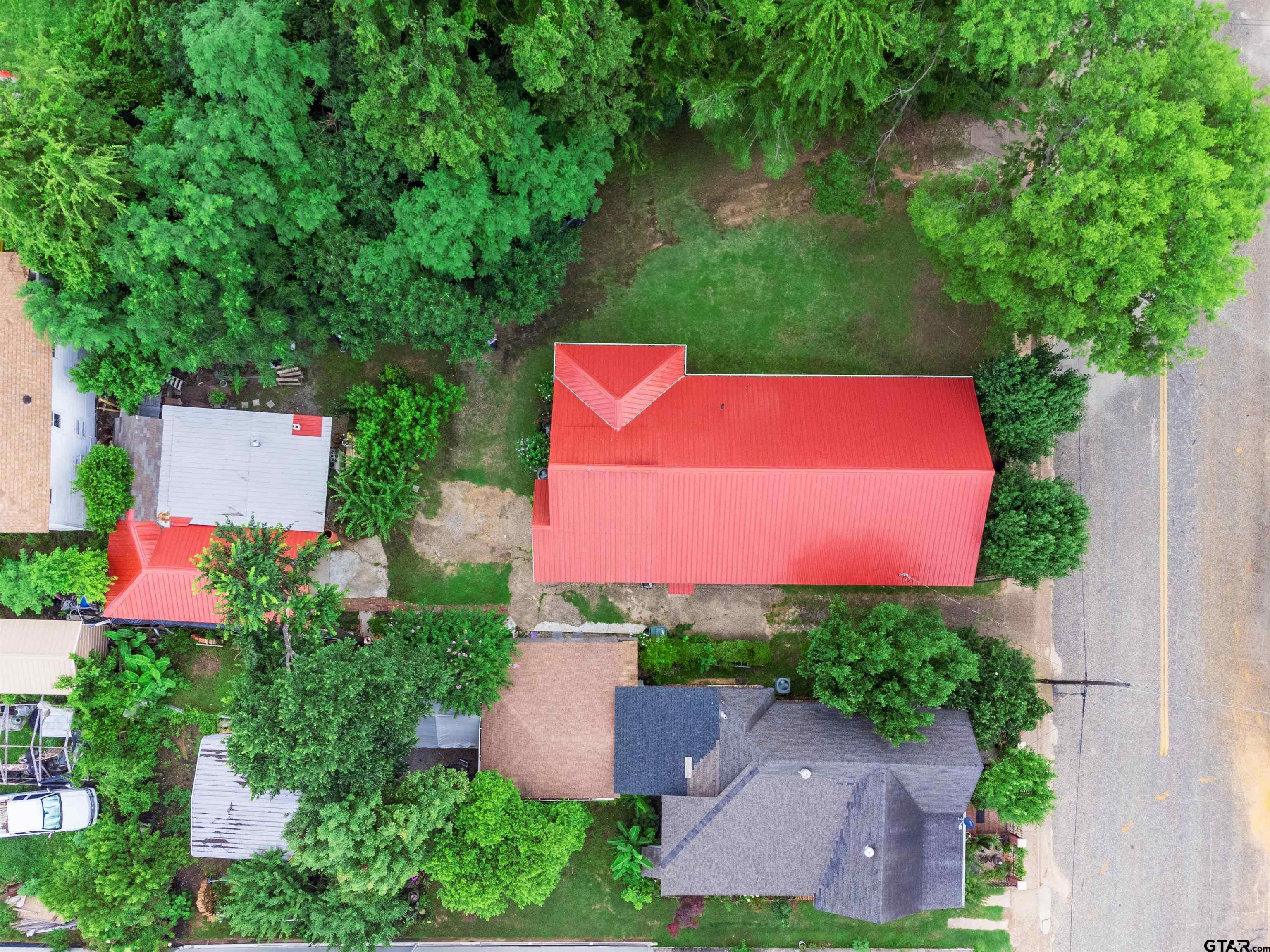 427 East Locust Street Tyler, TX 75702 - Photo 35 of 42 an aerial view of a house with pool garden and a yard