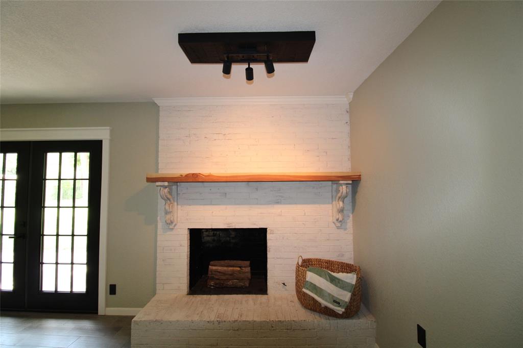 818 East Clinton Avenue Athens, TX 75751 - Photo 21 of 24 a living room with furniture and a fireplace