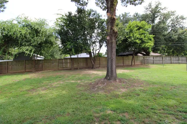 a view of a backyard with a trees