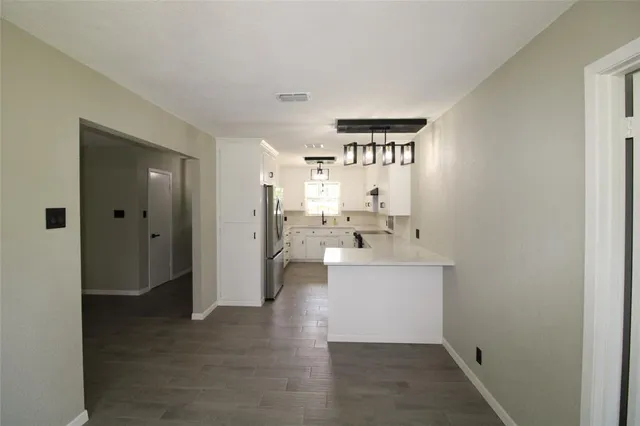 a view of a kitchen and a sink