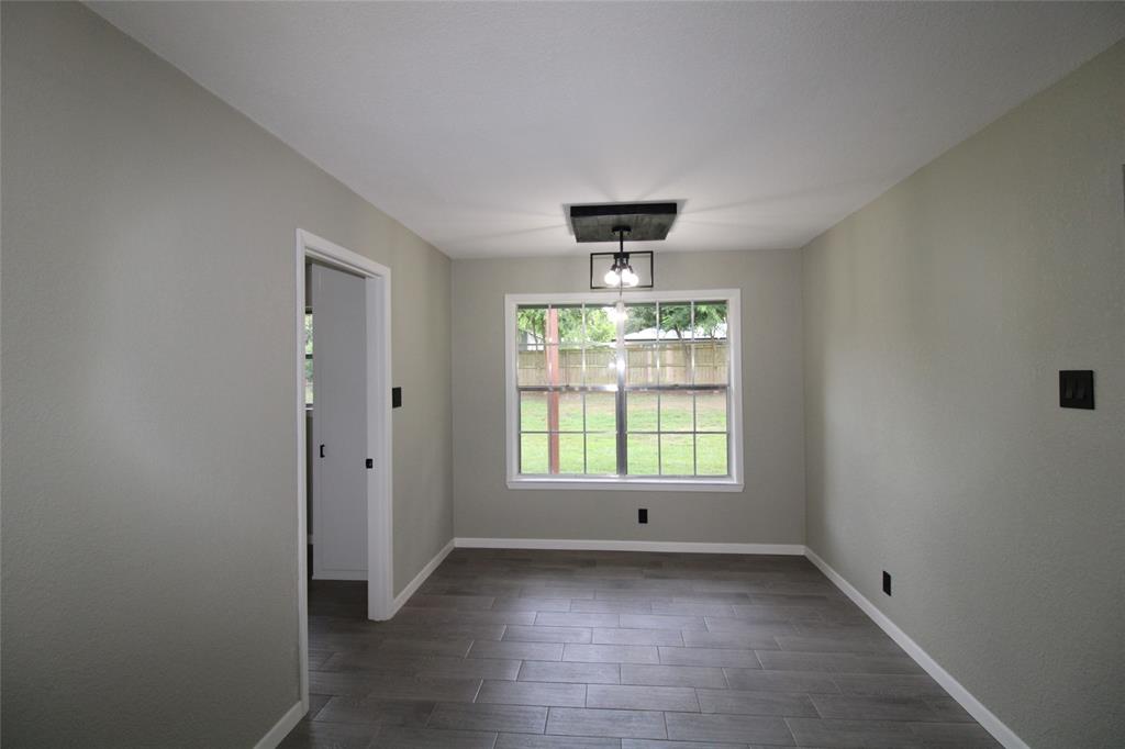 818 East Clinton Avenue Athens, TX 75751 - Photo 8 of 24 a view of an empty room with a window