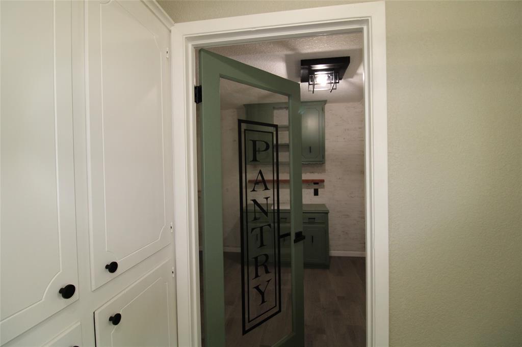 818 East Clinton Avenue Athens, TX 75751 - Photo 9 of 24 a bathroom with a glass door shower and vanity