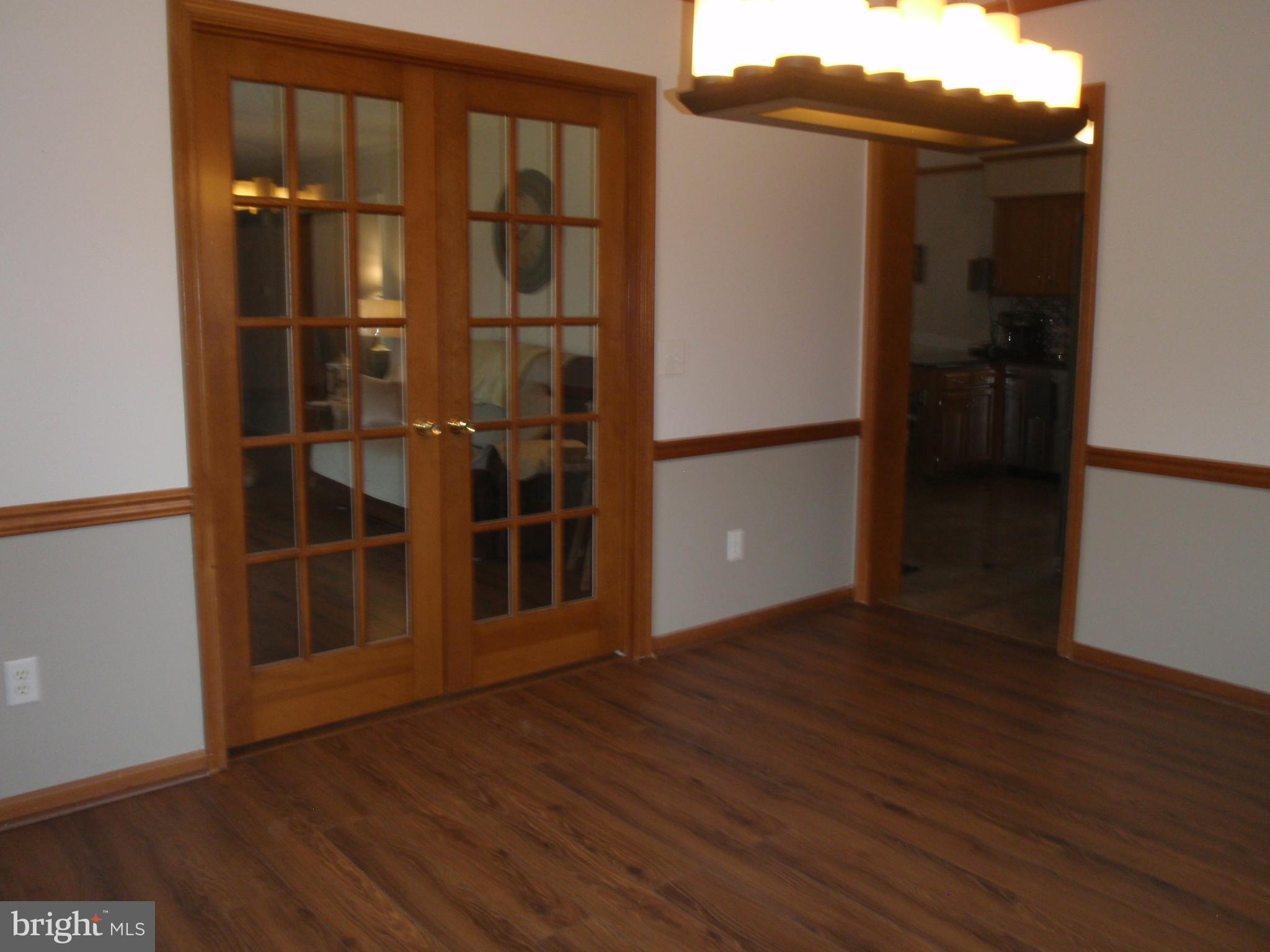 377 Paddock Road Smyrna, DE 19977 - Photo 14 of 58 Crown moulding, french door to living room