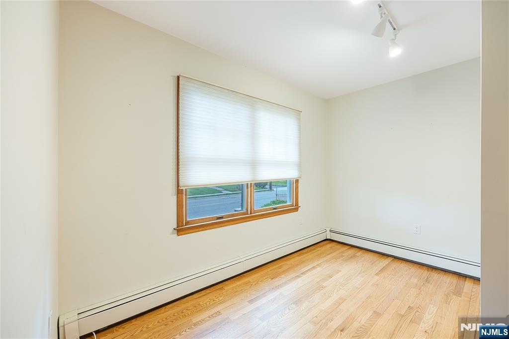 75 Columbus Drive Tenafly, NJ 07670 - Photo 14 of 26 an empty room with a window