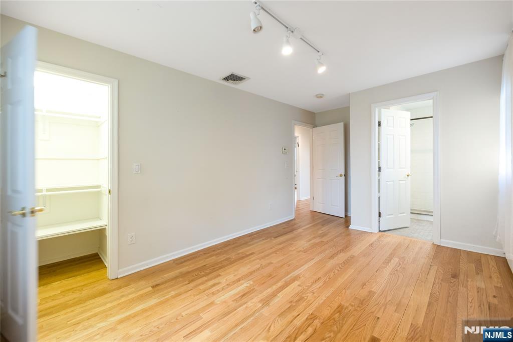 75 Columbus Drive Tenafly, NJ 07670 - Photo 16 of 26 a view of an empty room and window