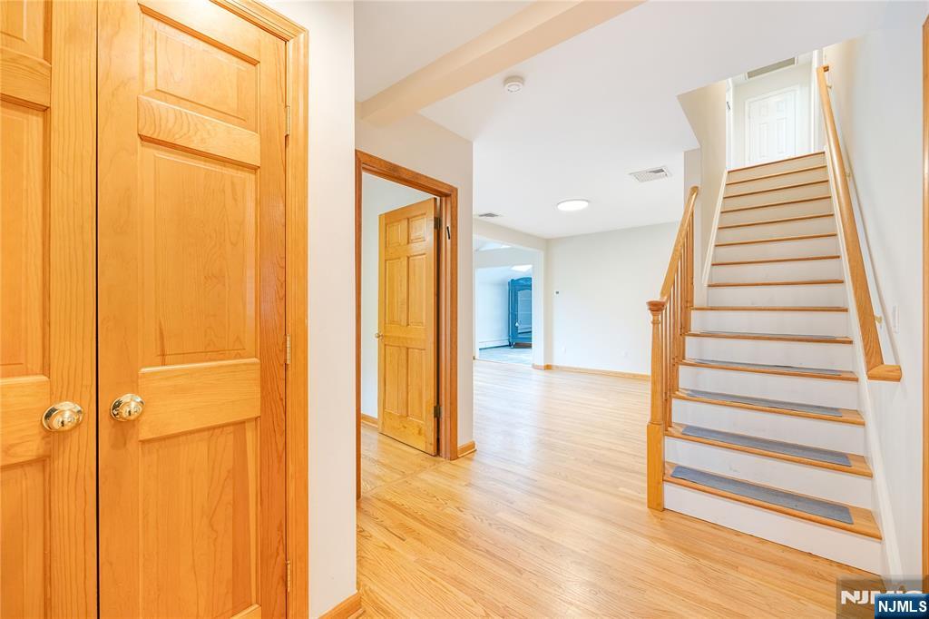 75 Columbus Drive Tenafly, NJ 07670 - Photo 2 of 26 a view of a hallway with wooden floor and entryway
