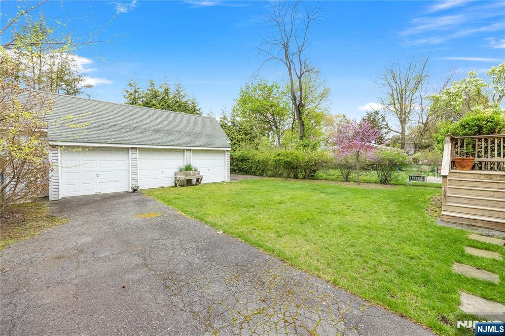 75 Columbus Drive Tenafly, NJ 07670 - Photo 24 of 26 a front view of house with yard and green space